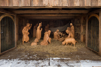 Wooden figures depict the birth of Jesus in Bethlehem.