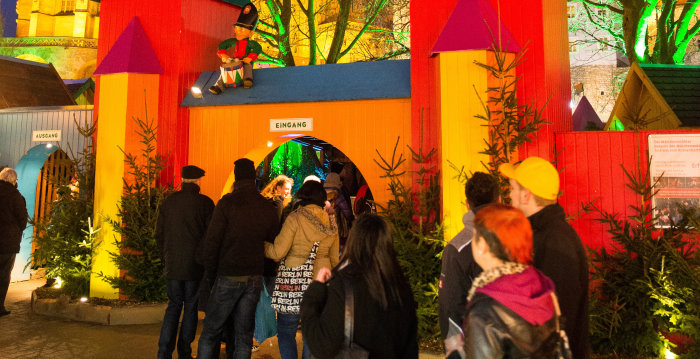 The visitors stream to the gates of the enchanted forest.